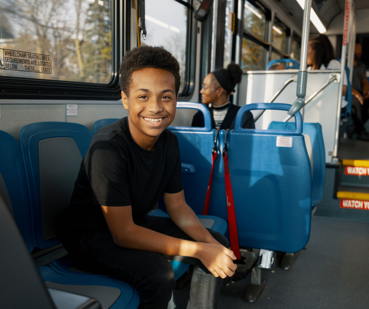Youth riding TARTA Bus with Youth Summer Blast Pass