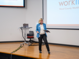 TARTA CEO, Laura Koprowski speaks on behalf of TARTA in Auditorium about WorkLink